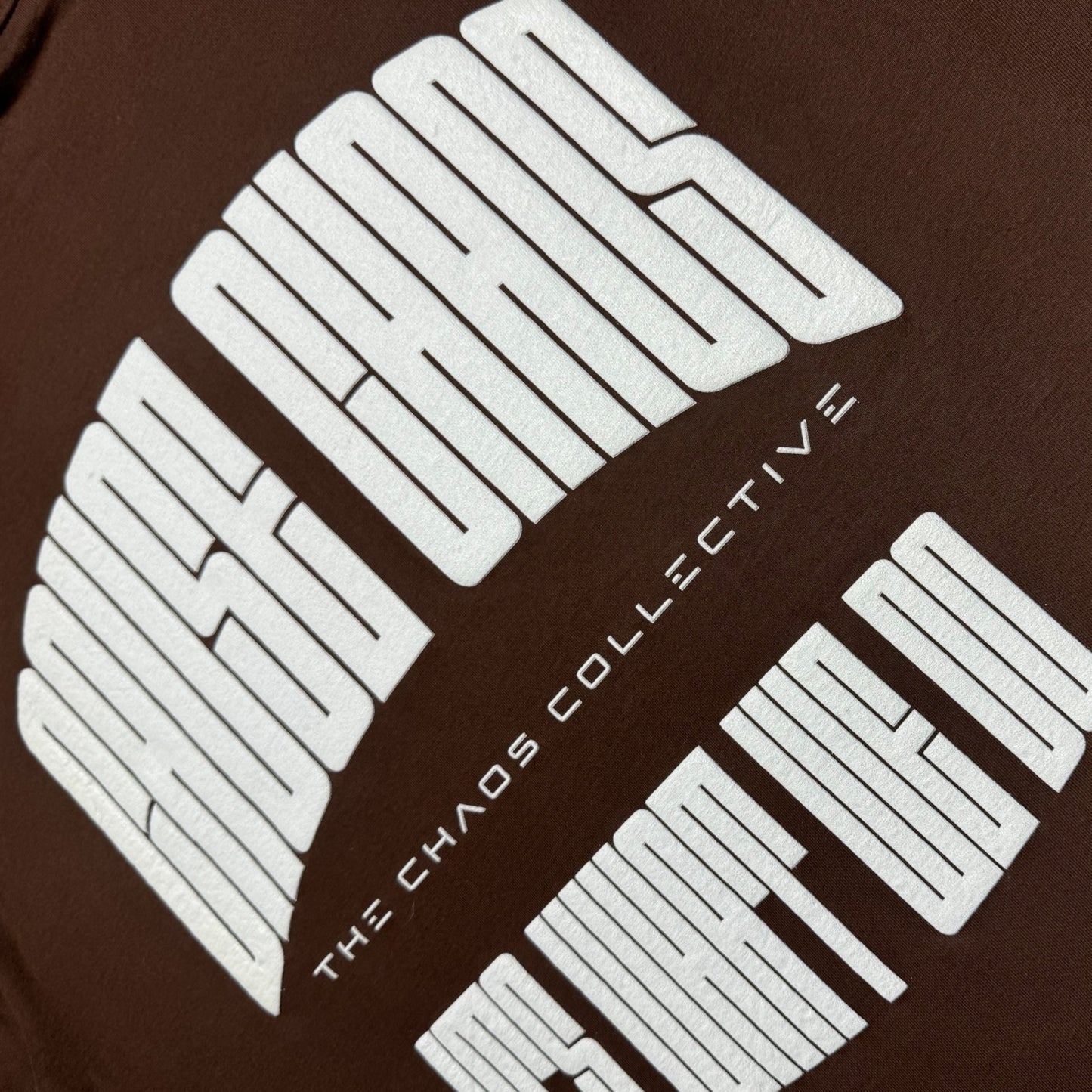 IT’S WHAT WE DO! BROWN PUFF TEE - Logo View - Flat Lay